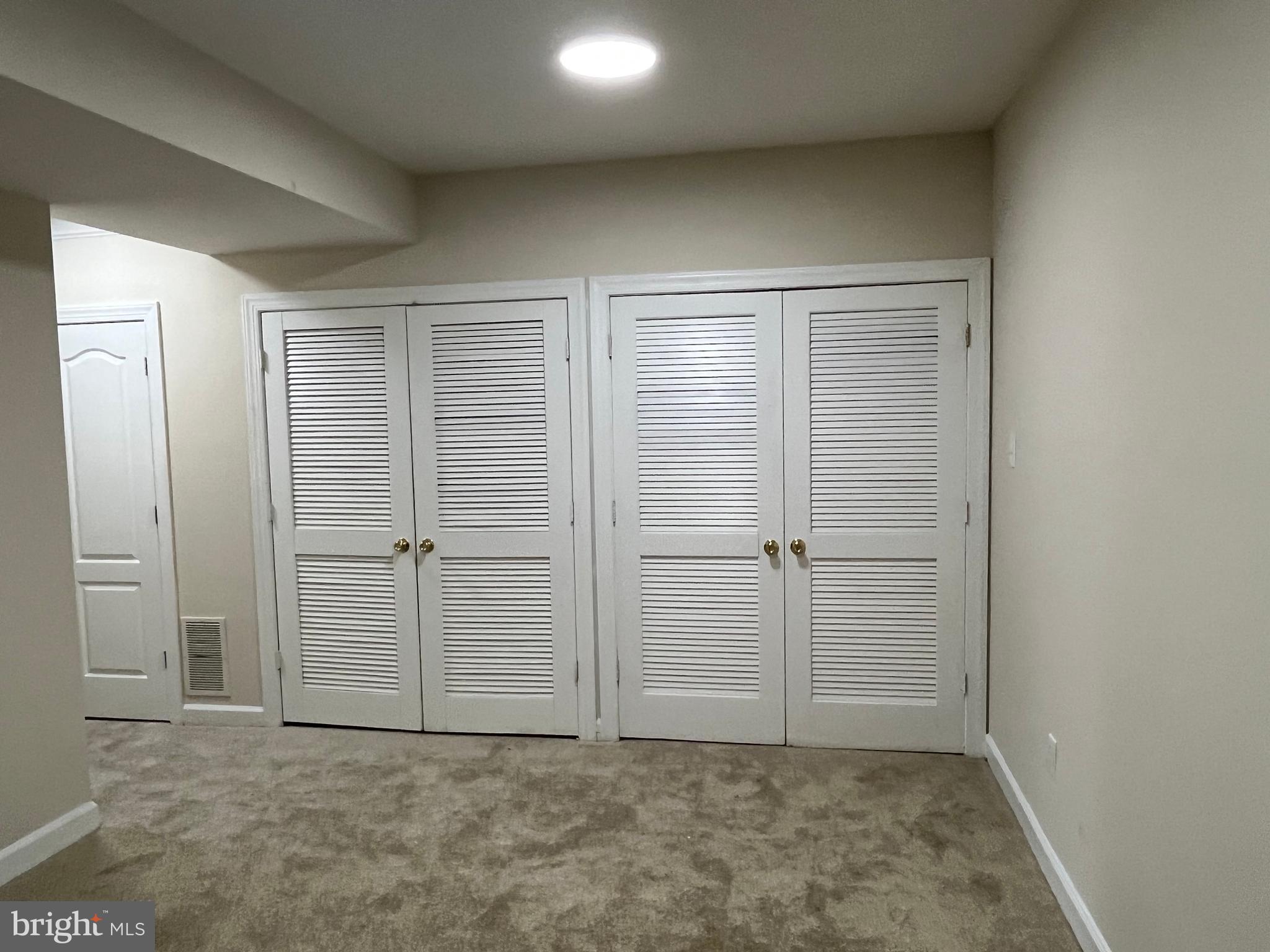3316 Castle Ridge Circle, Unit 16 Silver Spring, MD 20904 - Photo 8 of 71 an empty room with closet area