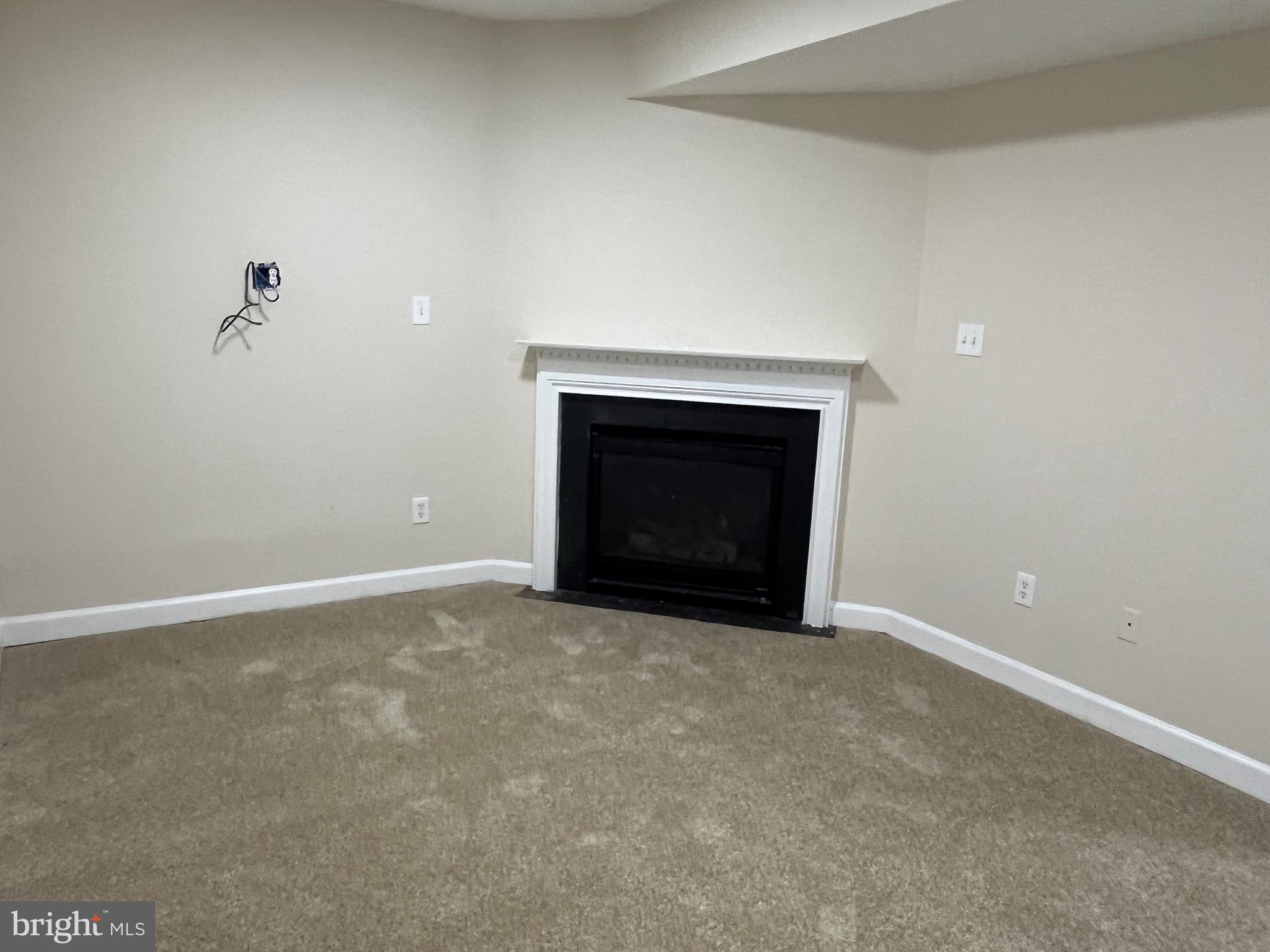 3316 Castle Ridge Circle, Unit 16 Silver Spring, MD 20904 - Photo 10 of 71 a view of empty room with a fireplace