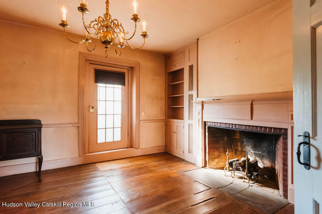 652 Albany Post Road New Paltz, NY 12561 - Photo 12 of 36 a view of a livingroom with a fireplace and window