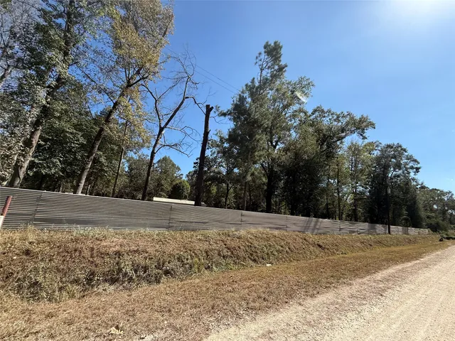 a view of empty space with large trees