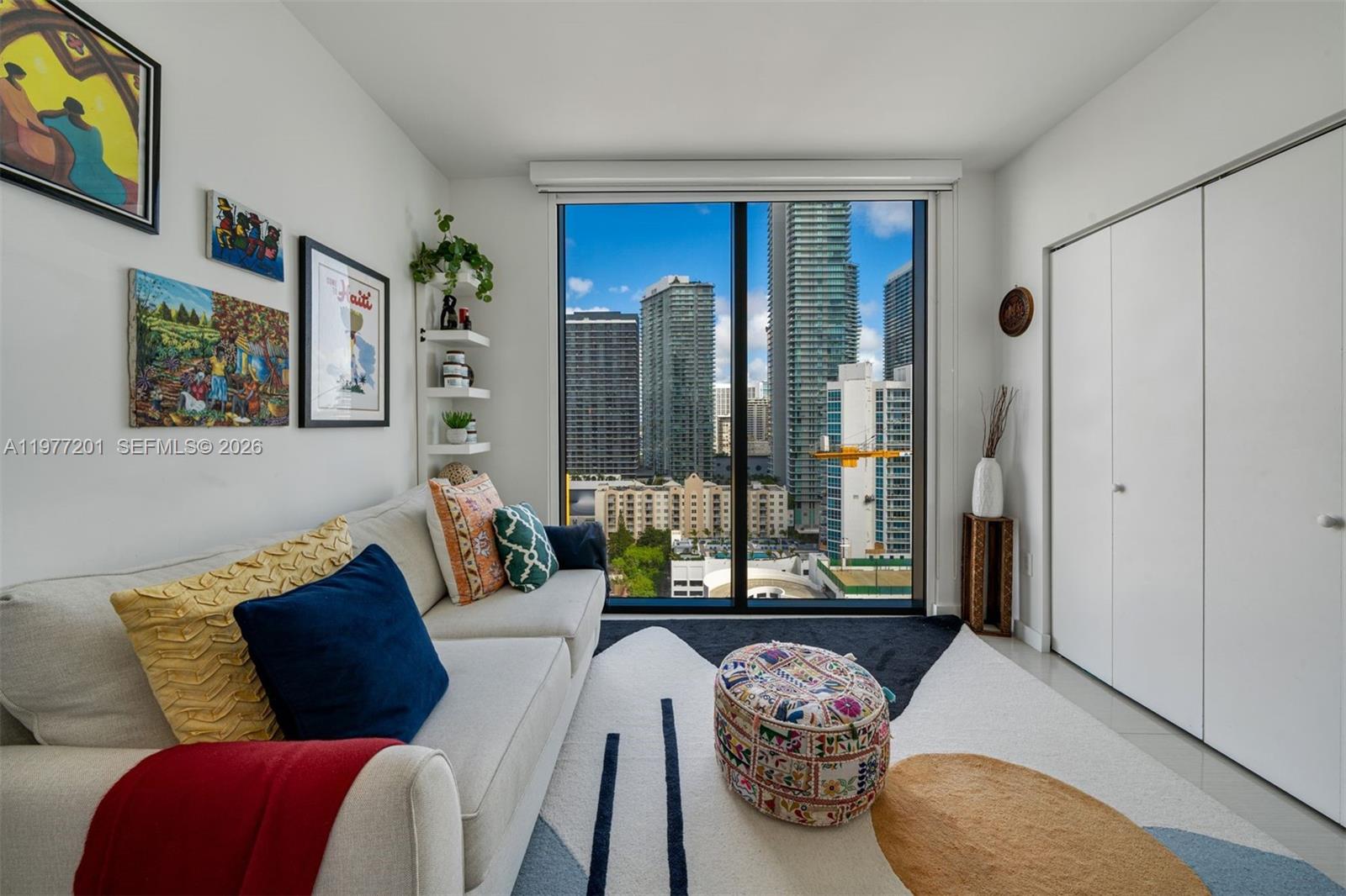 460 Northeast 28th Street, Unit 1901 Miami, FL 33137 - Photo 20 of 31 a living room with furniture and a potted plant