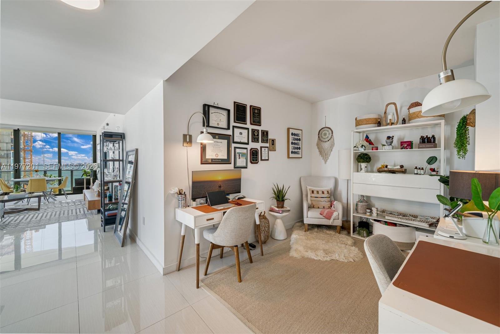460 Northeast 28th Street, Unit 1901 Miami, FL 33137 - Photo 9 of 31 a living room with furniture and a flat screen tv