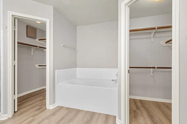 a bathroom with a bathtub and a shower