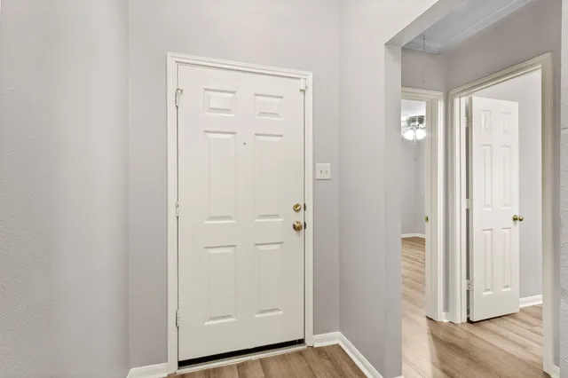 a view of a bathroom with wooden floor