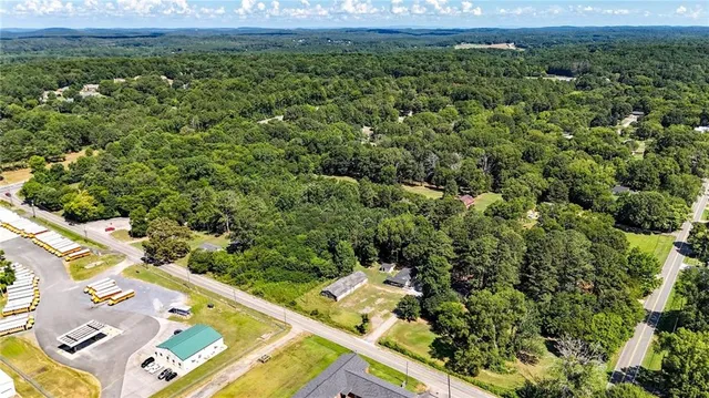 an aerial view of a yard with a table and chairs