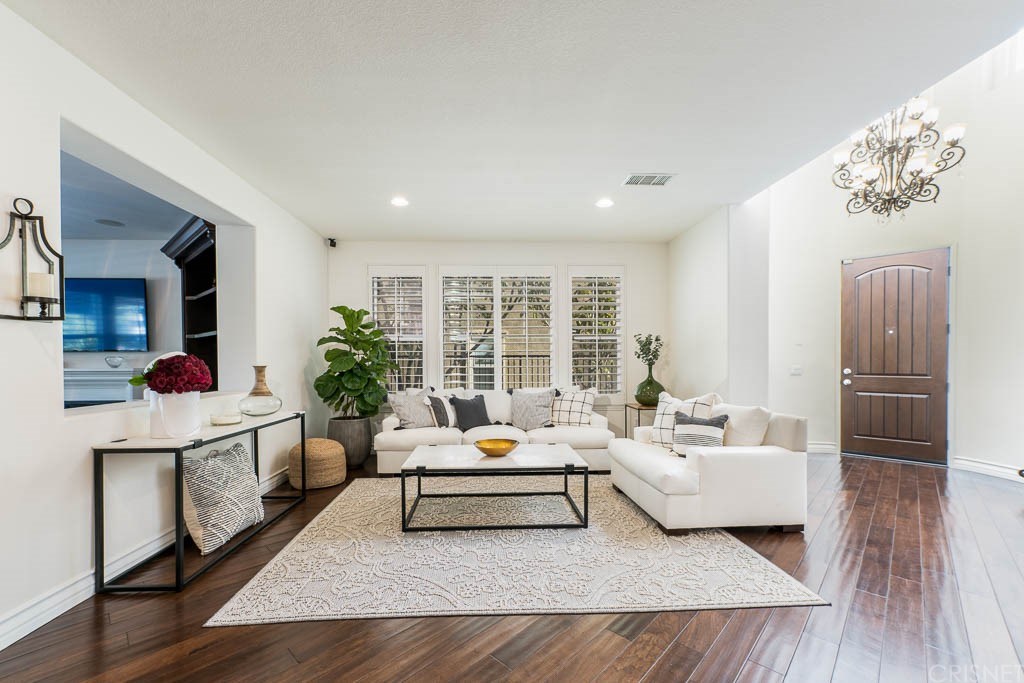 11564 Apulia Court Porter Ranch, CA 91326 - Photo 11 of 72 a living room with furniture and a large window