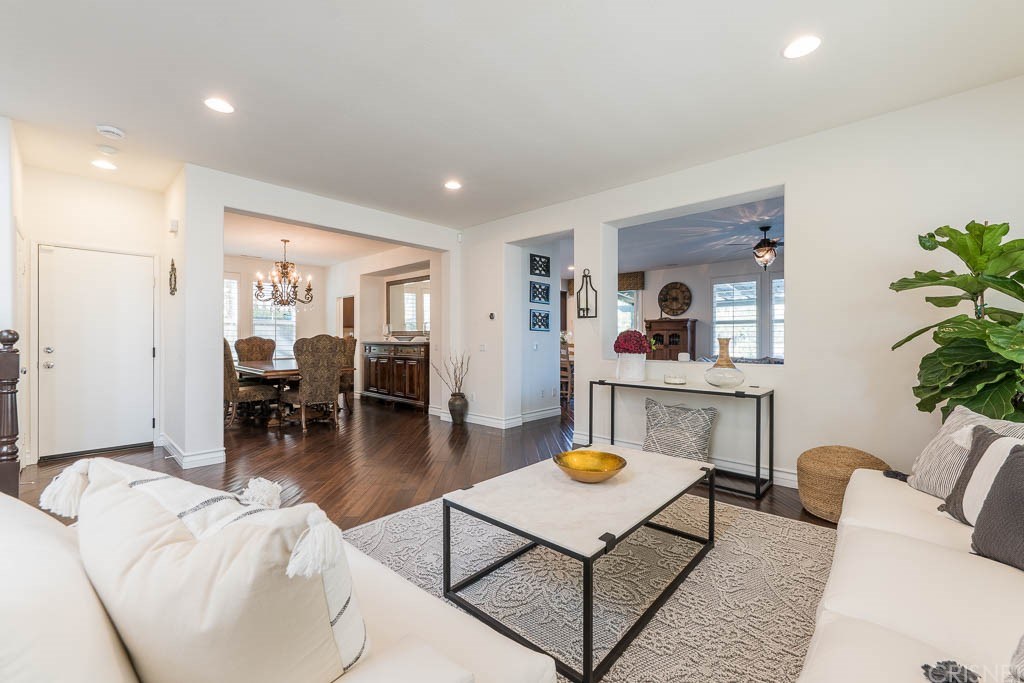11564 Apulia Court Porter Ranch, CA 91326 - Photo 12 of 72 a living room with furniture and a table