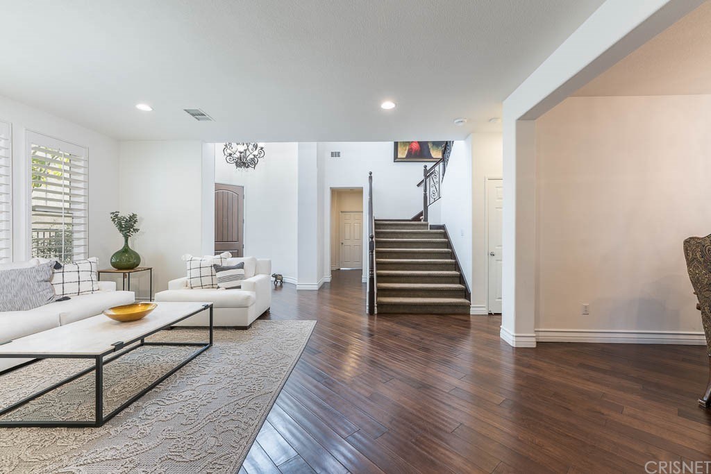 11564 Apulia Court Porter Ranch, CA 91326 - Photo 13 of 72 a living room with furniture and wooden floor