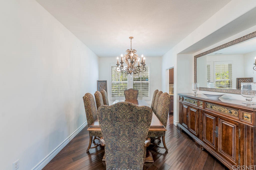 11564 Apulia Court Porter Ranch, CA 91326 - Photo 15 of 72 a view of a dining room with furniture window and wooden floor