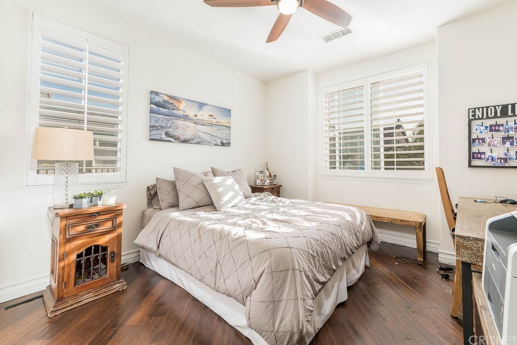 11564 Apulia Court Porter Ranch, CA 91326 - Photo 16 of 72 a bedroom with a bed a dresser and a window