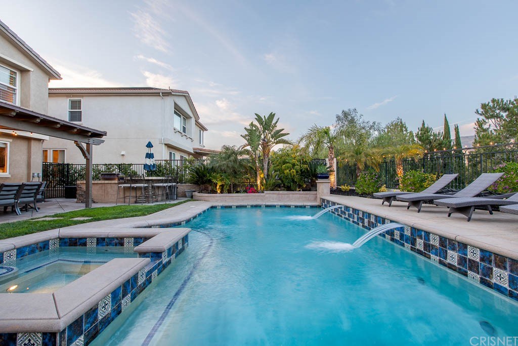 11564 Apulia Court Porter Ranch, CA 91326 - Photo 38 of 72 a view of a house with swimming pool and sitting area