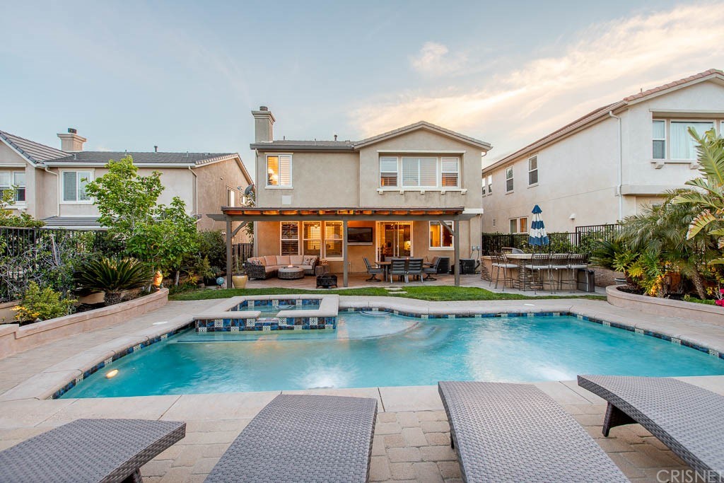 11564 Apulia Court Porter Ranch, CA 91326 - Photo 39 of 72 a house with swimming pool in front of it