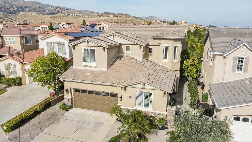 11564 Apulia Court Porter Ranch, CA 91326 - Photo 40 of 72 a aerial view of a house with a garden