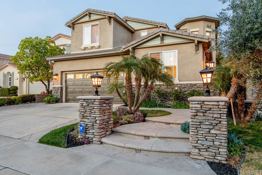 11564 Apulia Court Porter Ranch, CA 91326 - Photo 48 of 72 a front view of a house with garden