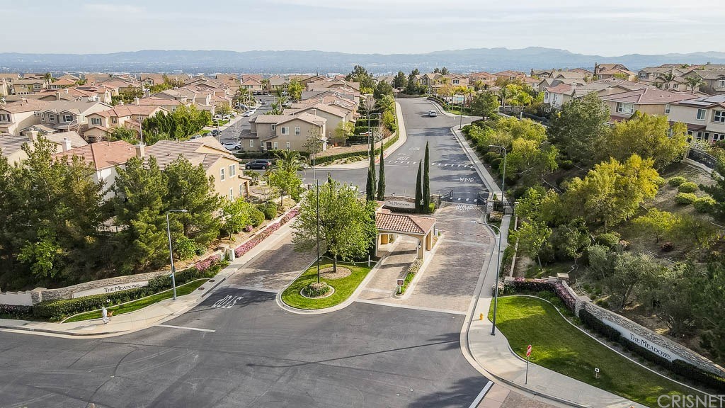 11564 Apulia Court Porter Ranch, CA 91326 - Photo 49 of 72 an aerial view of a house with a garden and lake view