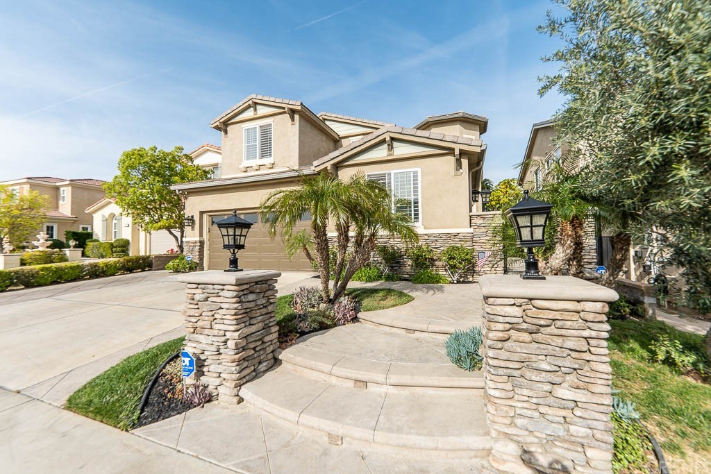 11564 Apulia Court Porter Ranch, CA 91326 - Photo 50 of 72 a front view of a house with a yard