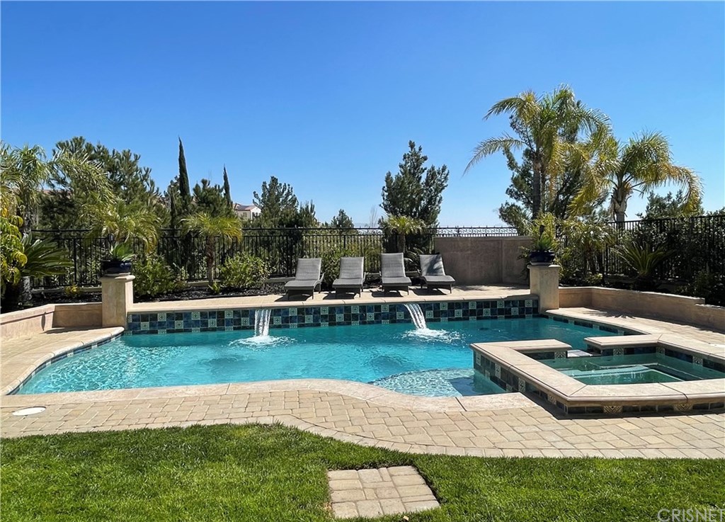 11564 Apulia Court Porter Ranch, CA 91326 - Photo 56 of 72 a view of a swimming pool with a patio
