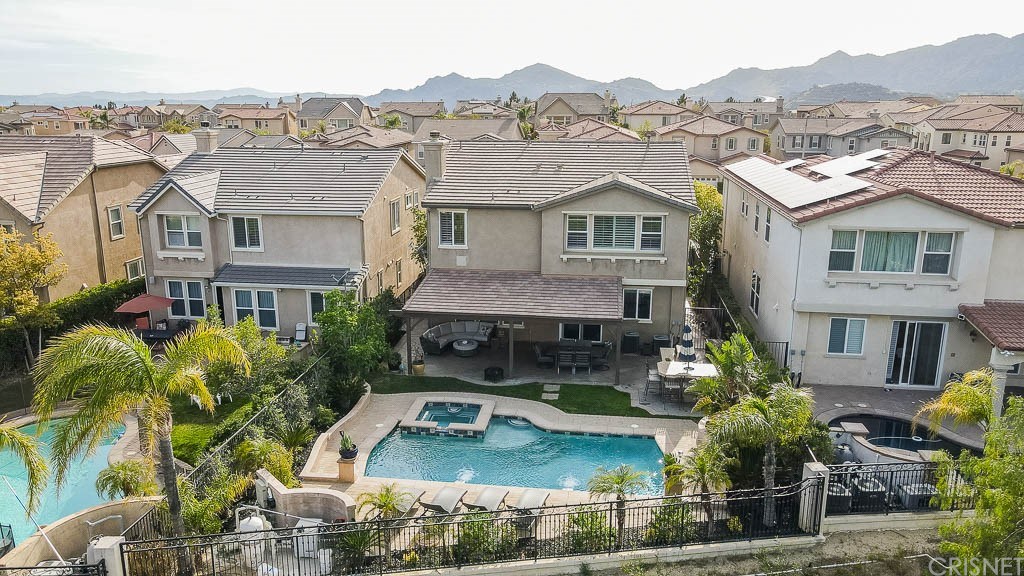 11564 Apulia Court Porter Ranch, CA 91326 - Photo 62 of 72 an aerial view of a house with a garden and lake view