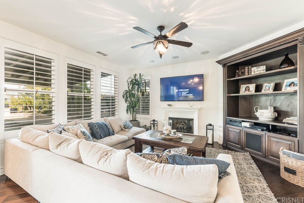 11564 Apulia Court Porter Ranch, CA 91326 - Photo 9 of 72 a living room with furniture fireplace and a large window