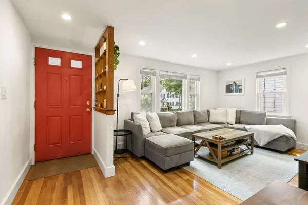 a spacious bedroom with a bed and a window