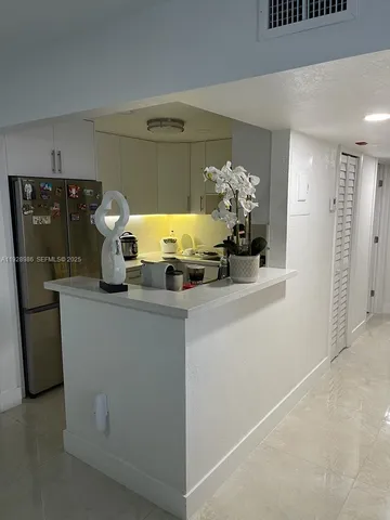 a view of living room with furniture and cars