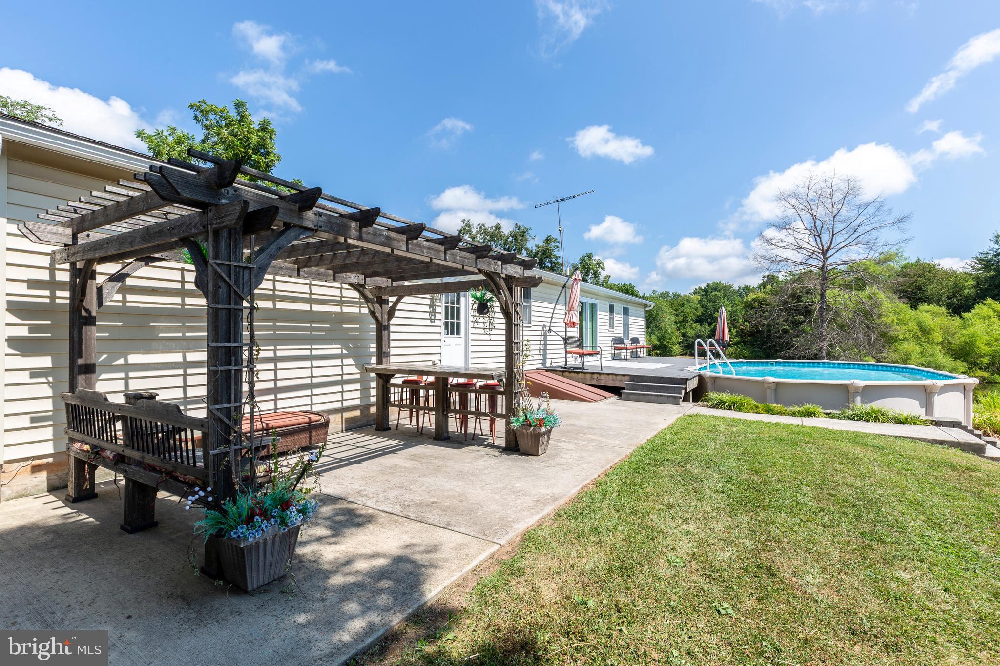 4184 Hanover Road Hanover, PA 17331 - Photo 54 of 67 a view of a patio with table and chairs potted plants with wooden fence