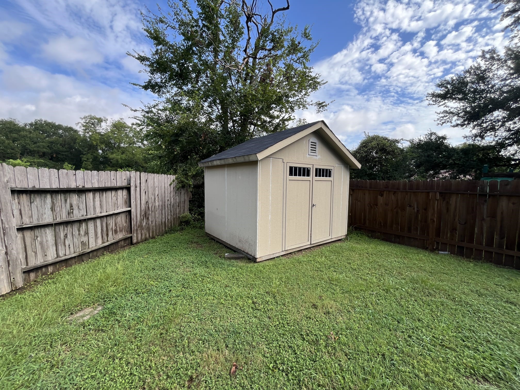 12007 Carriage Ridge Court Houston, TX 77070 - Photo 13 of 14 a view of a small barn with wooden fence