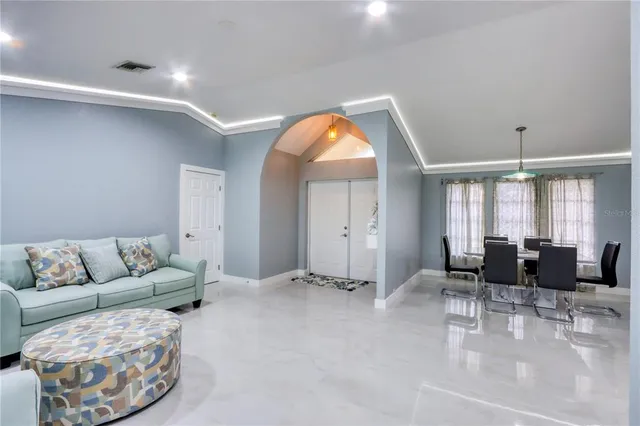 a view of a dining room with furniture window and outside view