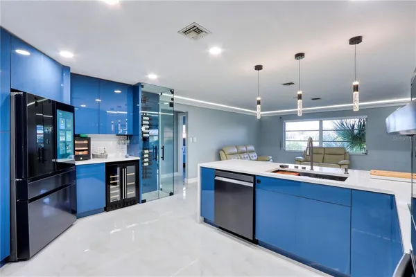 a kitchen with a sink stove and cabinets