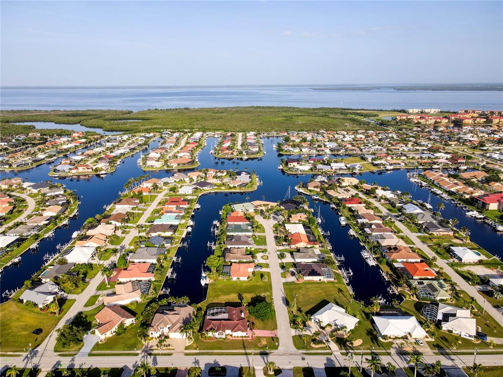 2500 Rio Lisbo Court Punta Gorda, FL 33950 - Photo 2 of 71 an aerial view of residential building and ocean