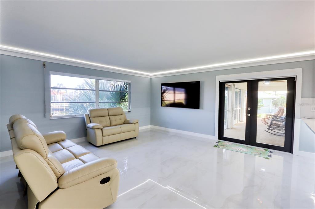 2500 Rio Lisbo Court Punta Gorda, FL 33950 - Photo 24 of 71 a living room with furniture and a flat screen tv