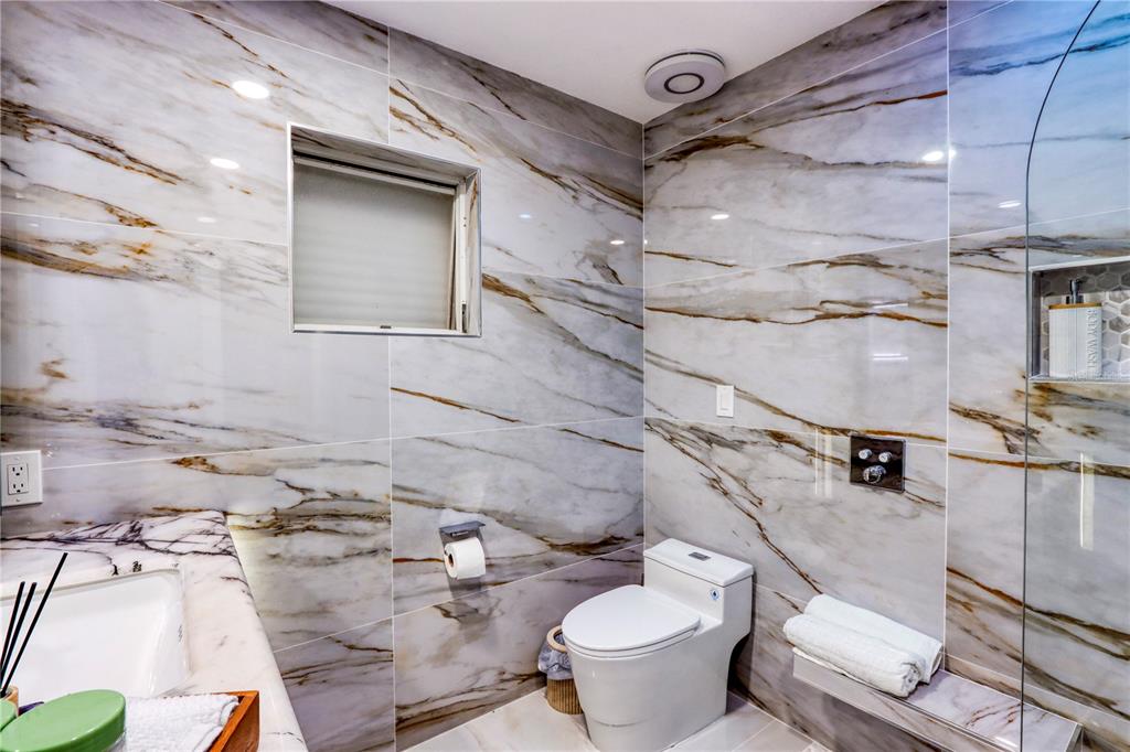 2500 Rio Lisbo Court Punta Gorda, FL 33950 - Photo 31 of 71 a bathroom with a sink mirror vanity and toilet