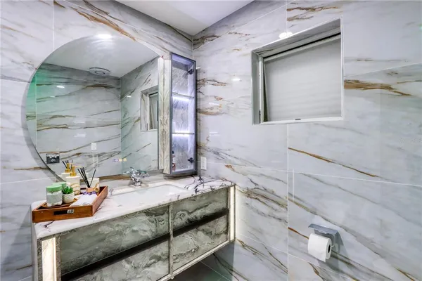 a close view of a utility room with dryer and washer