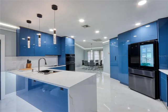 a bedroom with a large bed and a large mirror