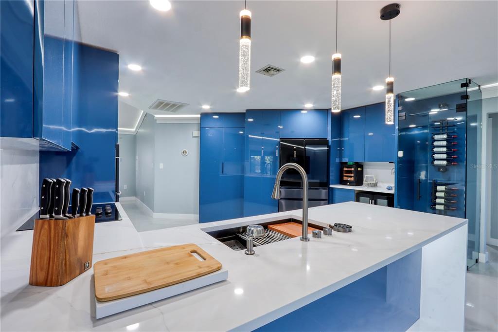 2500 Rio Lisbo Court Punta Gorda, FL 33950 - Photo 40 of 71 a view of a kitchen with kitchen island a sink stainless steel appliances and cabinets