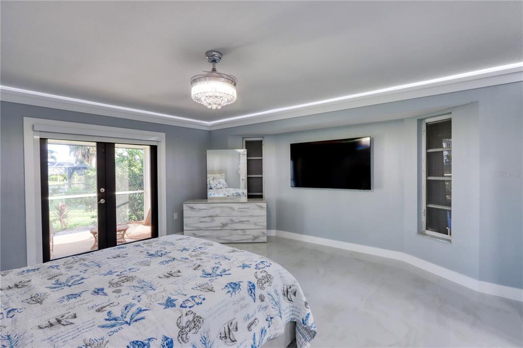 2500 Rio Lisbo Court Punta Gorda, FL 33950 - Photo 56 of 71 a bedroom with a large bed and a window