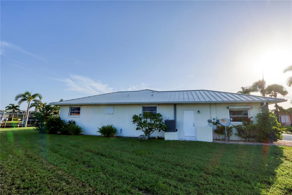 2500 Rio Lisbo Court Punta Gorda, FL 33950 - Photo 69 of 71 a view of a house with backyard and a garden