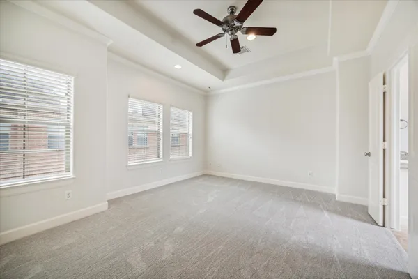 a bathroom with a granite countertop sink a mirror a bathtub and shower