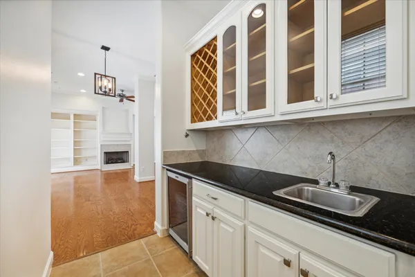 a kitchen with stainless steel appliances granite countertop a sink and cabinets