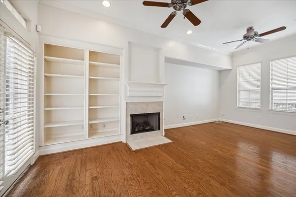 wooden floor in an empty room with a window