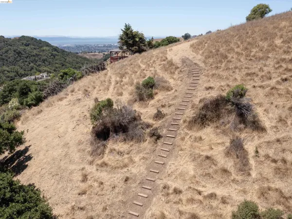 a view of a mountain range with trees in the background