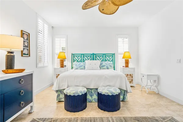 a bedroom with a bed and dresser