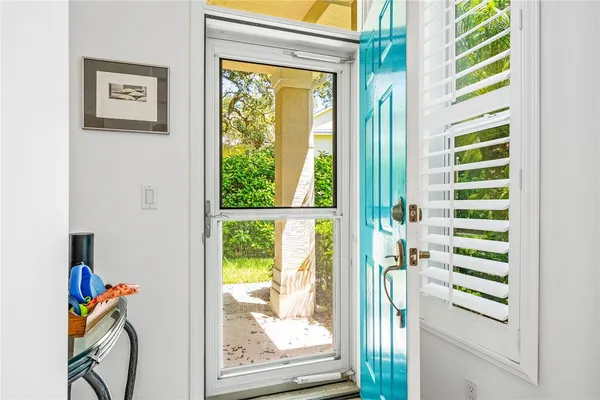 a view of front door with wooden floor