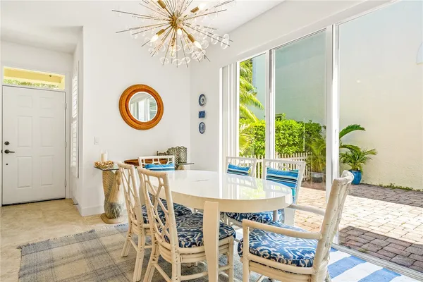 a dining room with furniture and a window