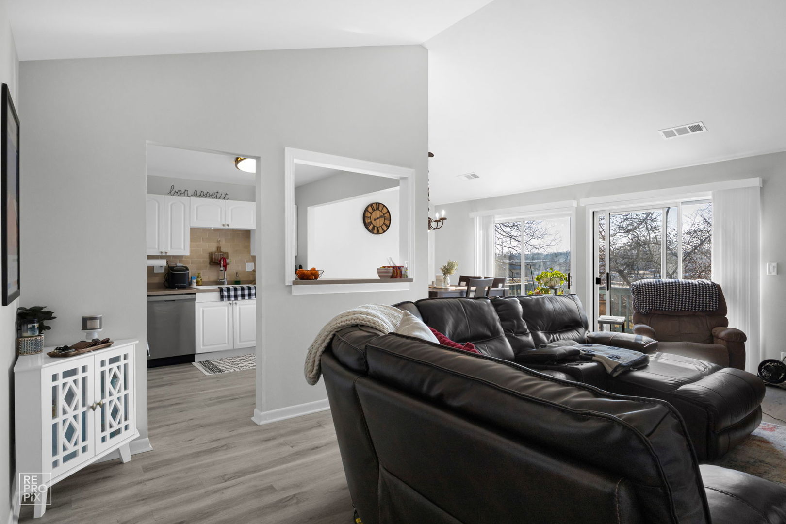 1588 Burr Oak Court, Unit B Wheaton, IL 60189 - Photo 2 of 10 a living room with furniture and a large window