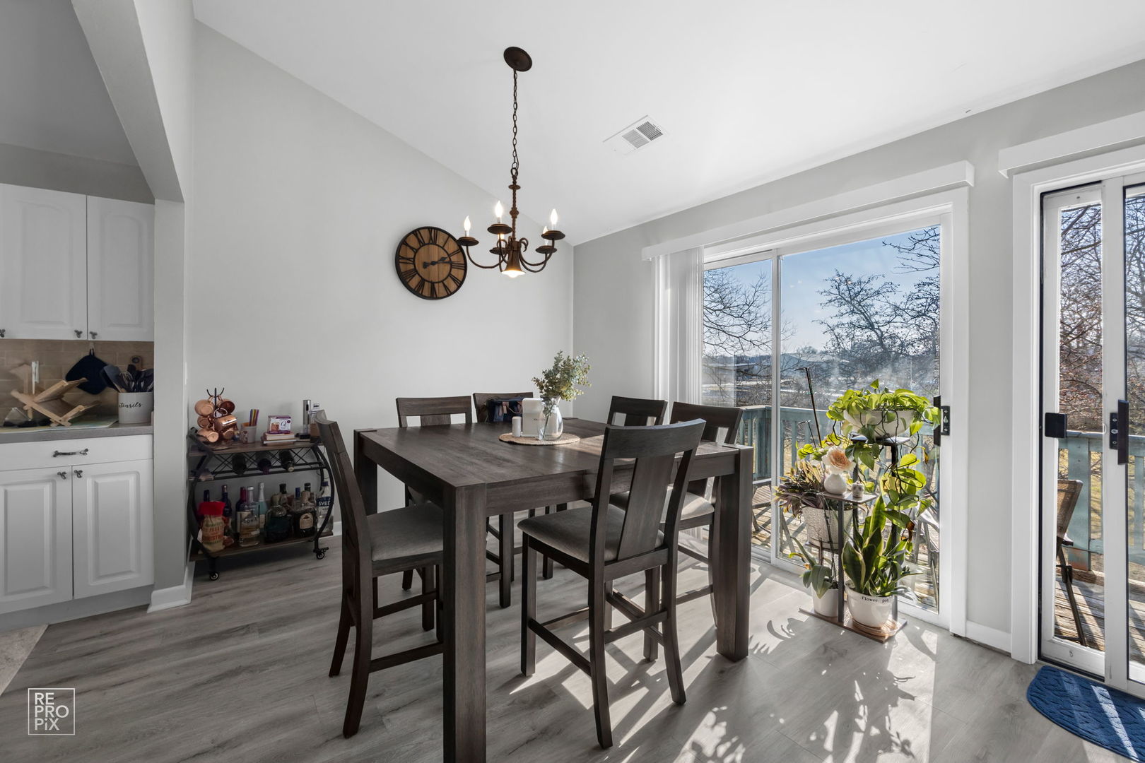 1588 Burr Oak Court, Unit B Wheaton, IL 60189 - Photo 4 of 10 a view of a dining room with furniture window and wooden floor