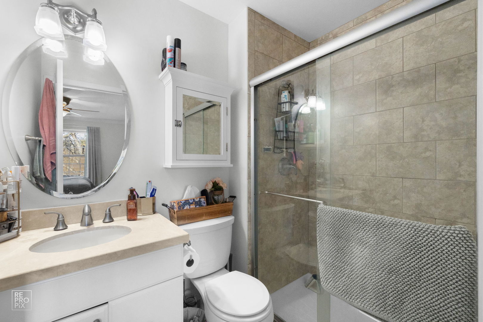 1588 Burr Oak Court, Unit B Wheaton, IL 60189 - Photo 10 of 10 a bathroom with a sink toilet vanity and shower