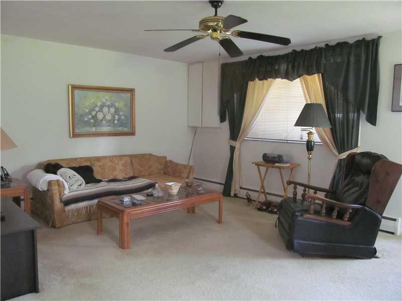 3408 Foster Road White Oak, PA 15131 - Photo 15 of 16 Living Room. Unit 239 Living Room another view. This unit is lower level and faces Carmella and only one with address on Carmella. It is open hallway to bedroom and 2nd room currently used as home office room. Rooms are versatile depending on tenants needs.