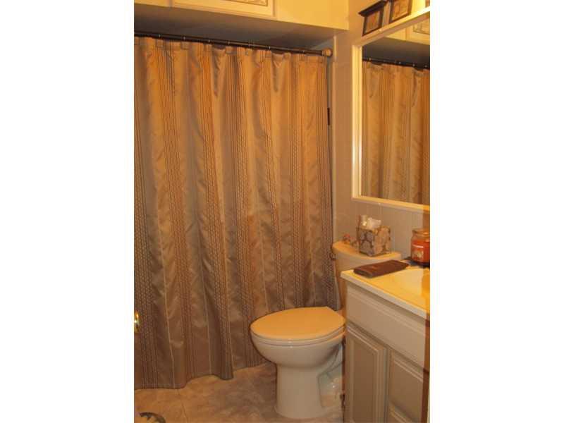 Full Bath. unit 3408.  Several items purchased by tenant will go with tenant should they move.  Original fixtures have been saved.