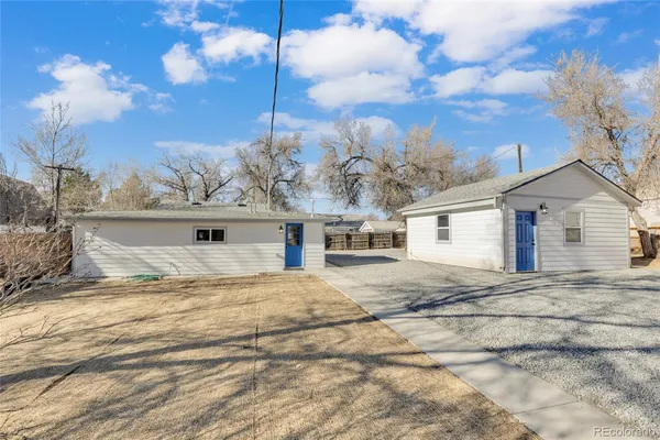 a view of a house with a snow in the yard